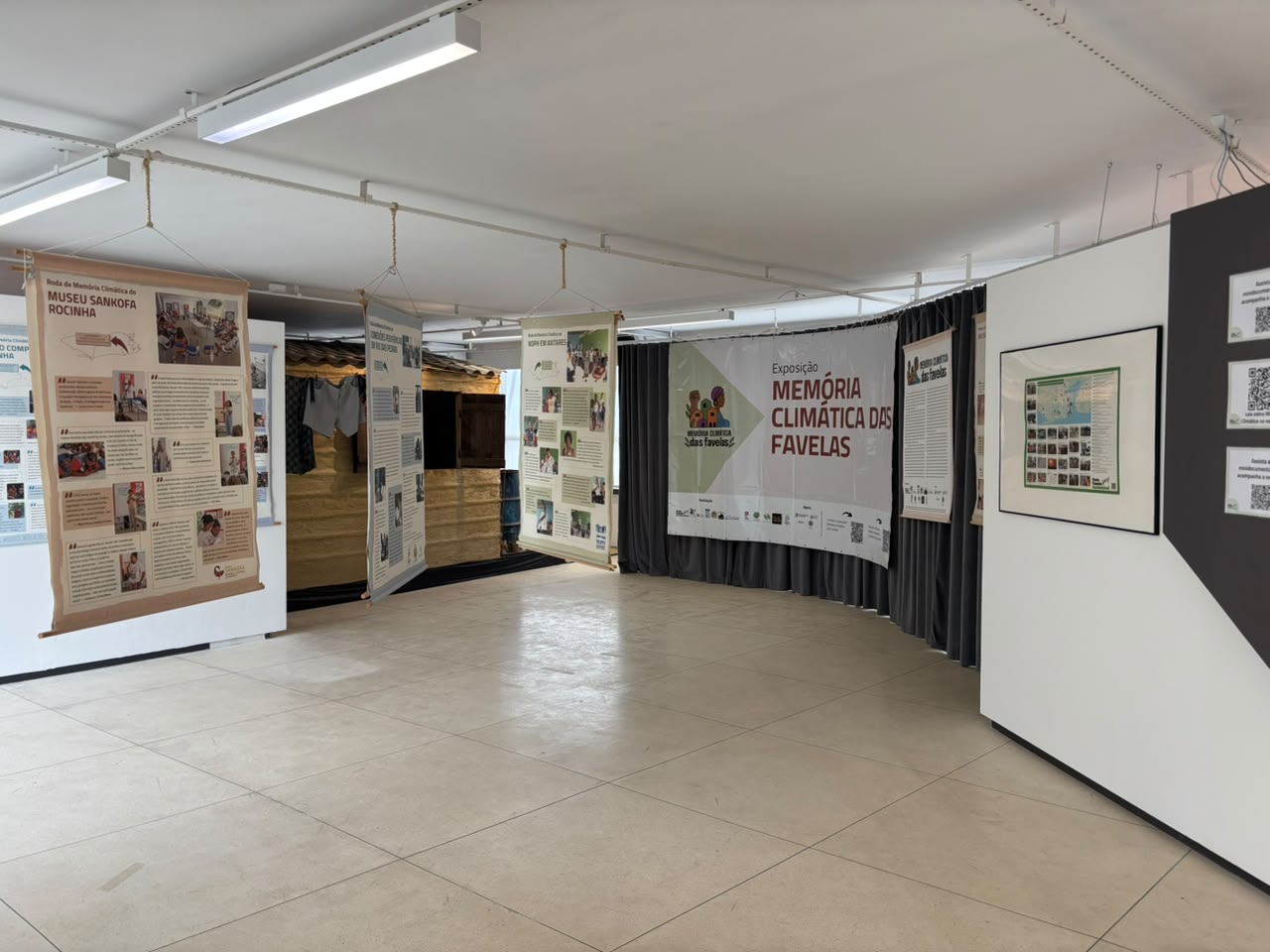 Banner principal da exposição Memória Climática das Favelas.
